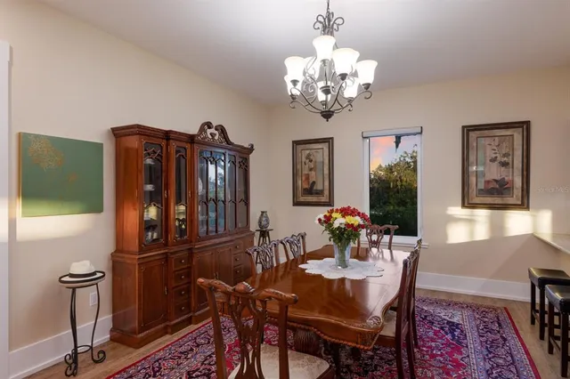 a large kitchen with stainless steel appliances and cabinets