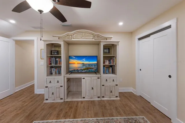 an aerial view of residential houses with outdoor space and parking