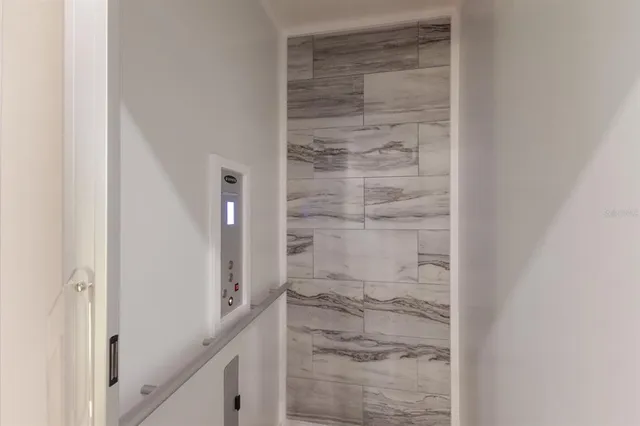 an aerial view of a house with a lake view