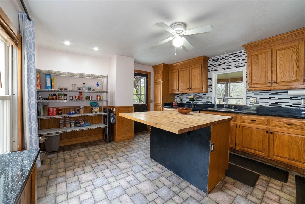 4 Brown Street Spencer, MA 01562 - Photo 12 of 34 a kitchen with stainless steel appliances granite countertop a sink and cabinets