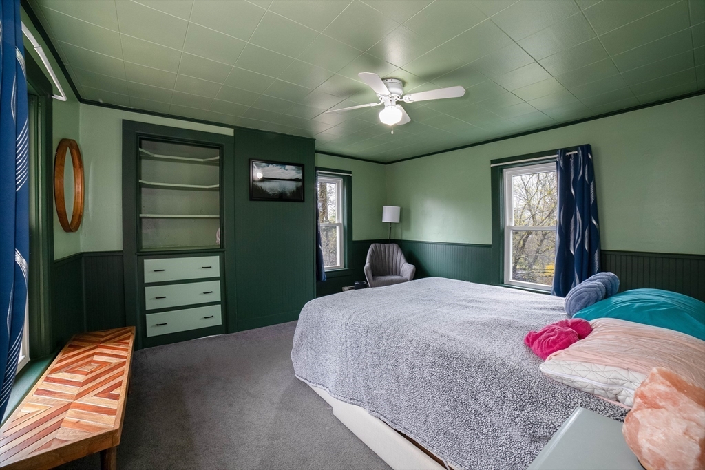 4 Brown Street Spencer, MA 01562 - Photo 14 of 34 a bedroom with a bed and a chandelier