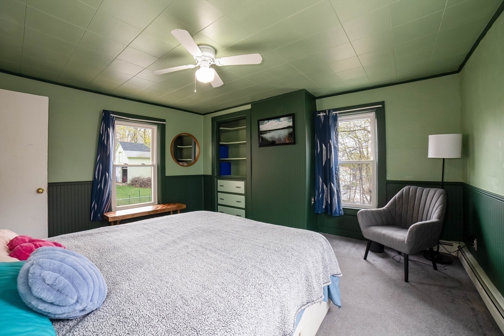 4 Brown Street Spencer, MA 01562 - Photo 15 of 34 a bedroom with a bed and a chandelier