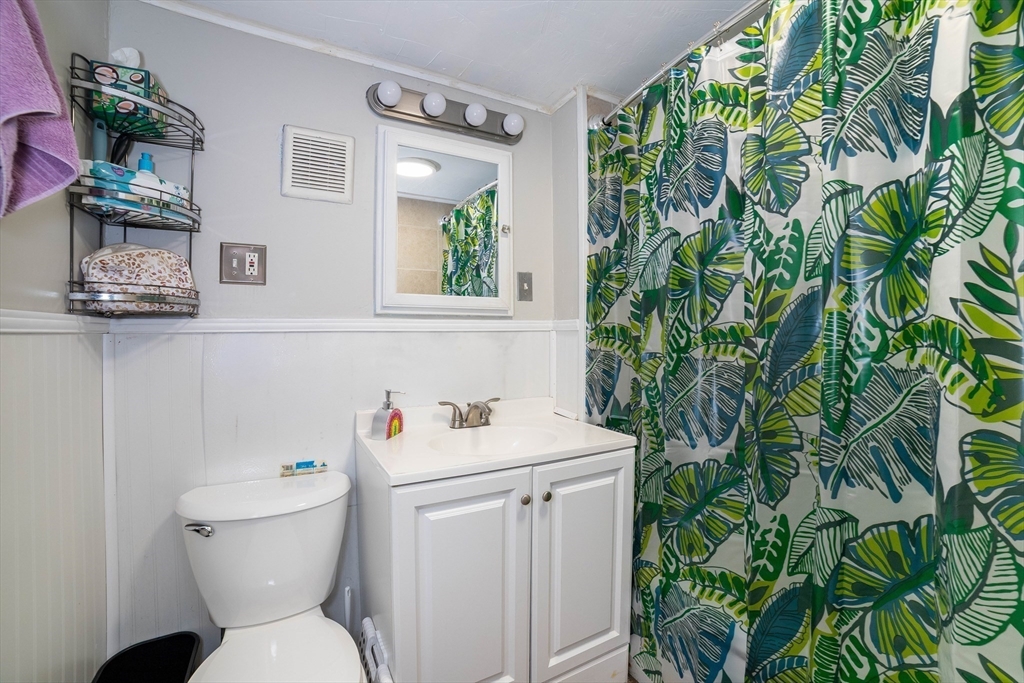 4 Brown Street Spencer, MA 01562 - Photo 16 of 34 a bathroom with a sink and mirror with toilet