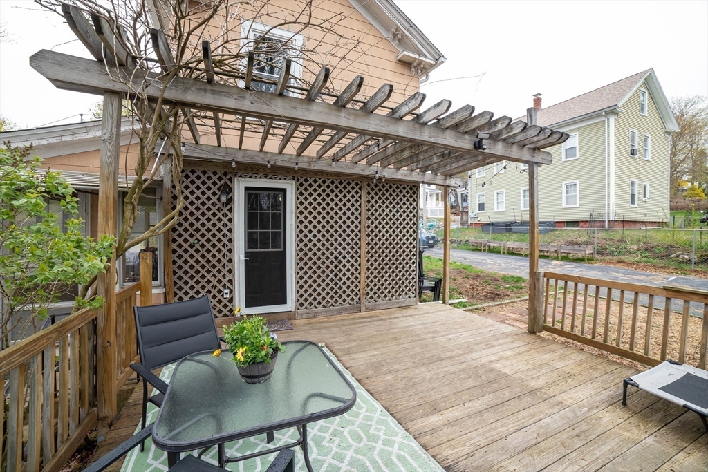 4 Brown Street Spencer, MA 01562 - Photo 28 of 34 a view of a house with a chairs and table in a patio