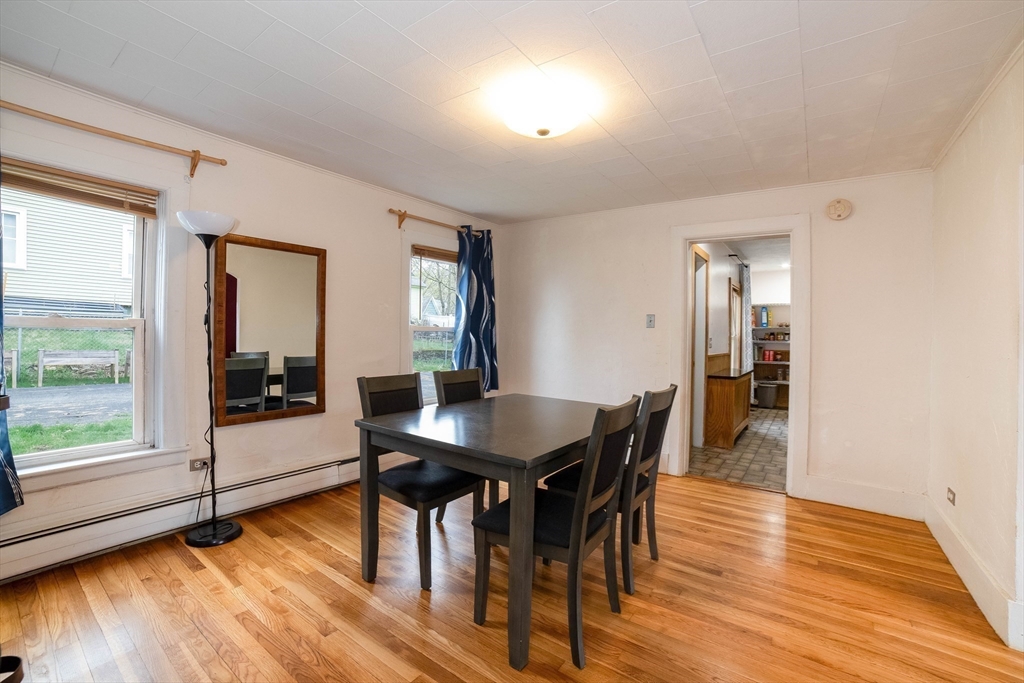 4 Brown Street Spencer, MA 01562 - Photo 5 of 34 a view of a a dining room with furniture window and wooden floor