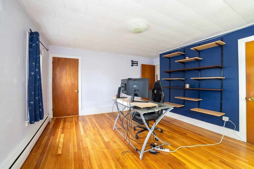 4 Brown Street Spencer, MA 01562 - Photo 7 of 34 a view of a workspace with furniture and wooden floor
