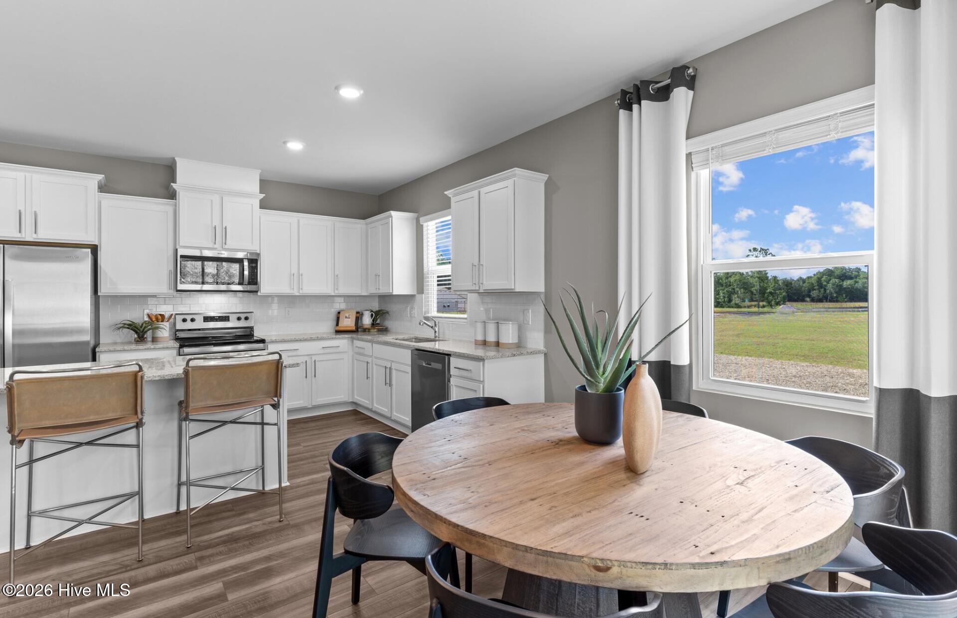 209 Ocean Pointe Boulevard Southeast, Unit 201 Bolivia, NC 28422 - Photo 2 of 19 Untitled design - Ibis Kitchen and Dinin