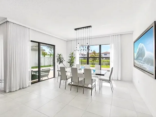 a kitchen with counter top space and living room