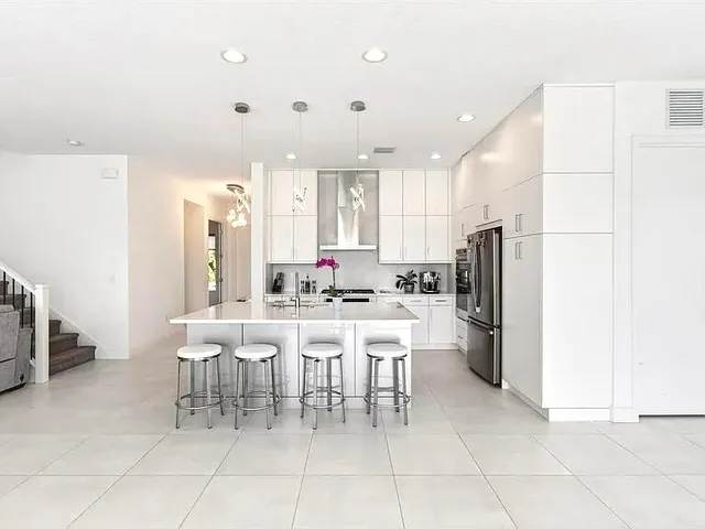 a view of an entryway with a floor to ceiling window and an outdoor space