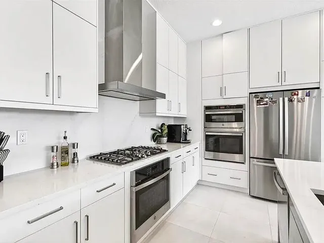 a living room with furniture a window and a fireplace
