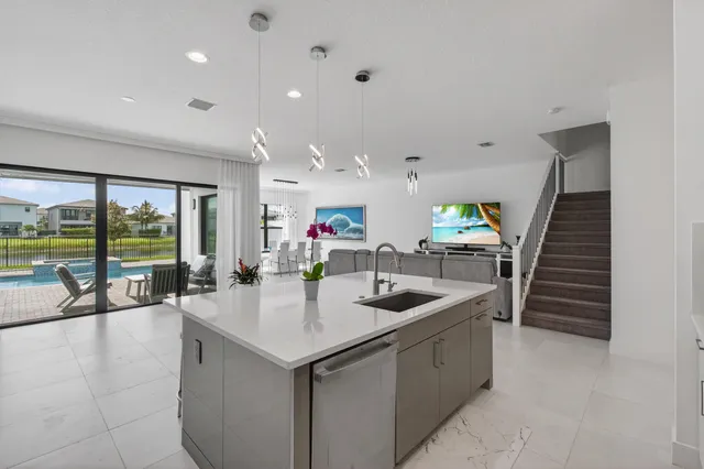 a utility room with sink dryer and washer
