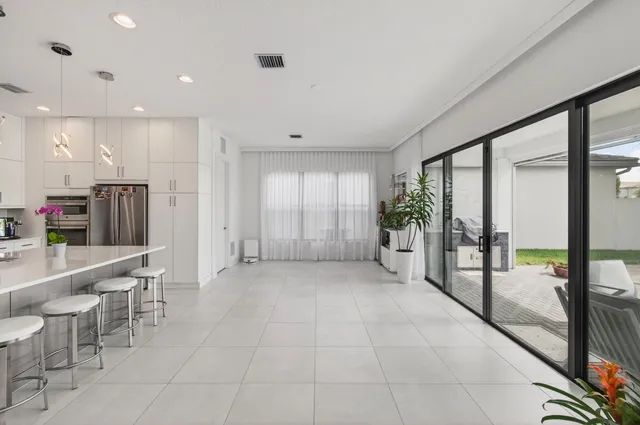 a bedroom with a large bed and a large window