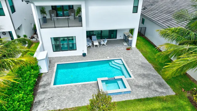 a view of backyard with outdoor seating