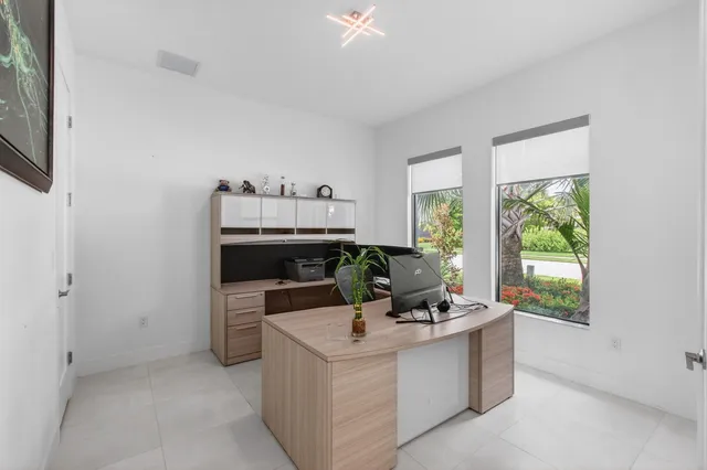 a view of a room with window and wooden fence