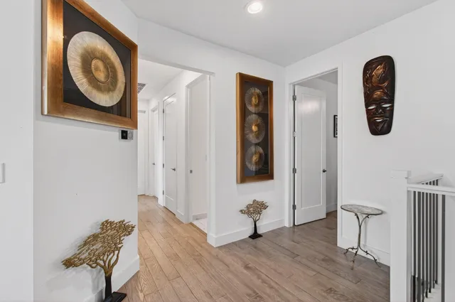 a bathroom with a toilet a sink and a mirror