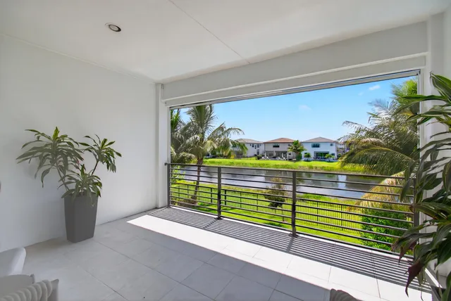 a view of swimming pool with a lounge chairs