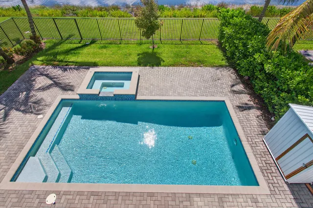 a view of a lake with houses in the back