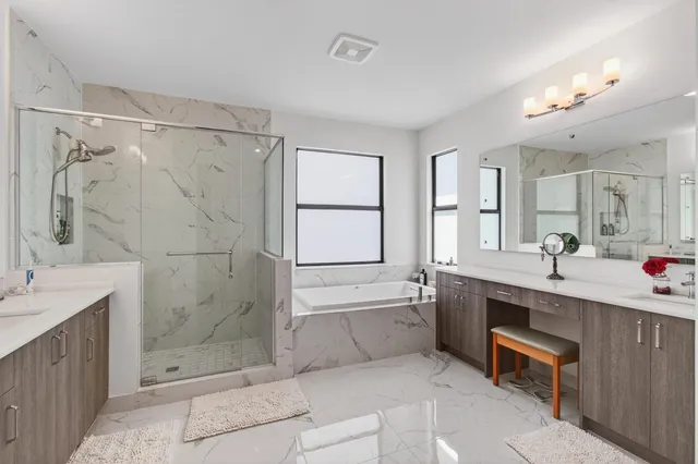 a view of a lake with houses in the back