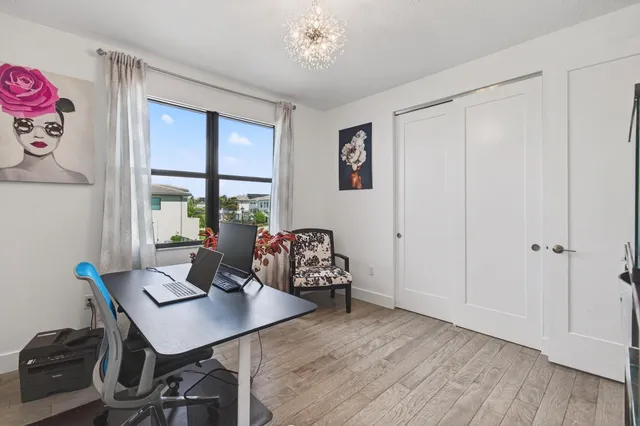 a kitchen with stainless steel appliances granite countertop a stove a sink and a wooden floors
