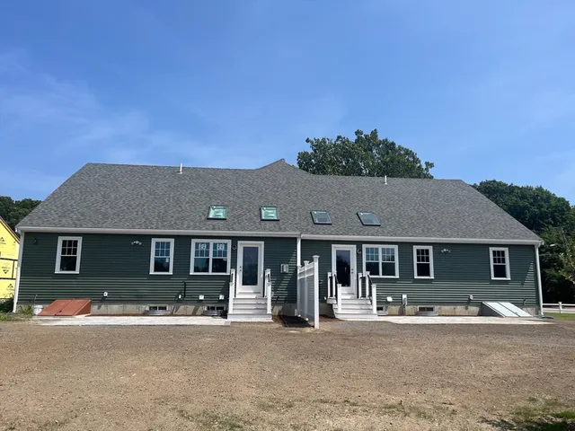 a front view of a house with yard patio and fire pit