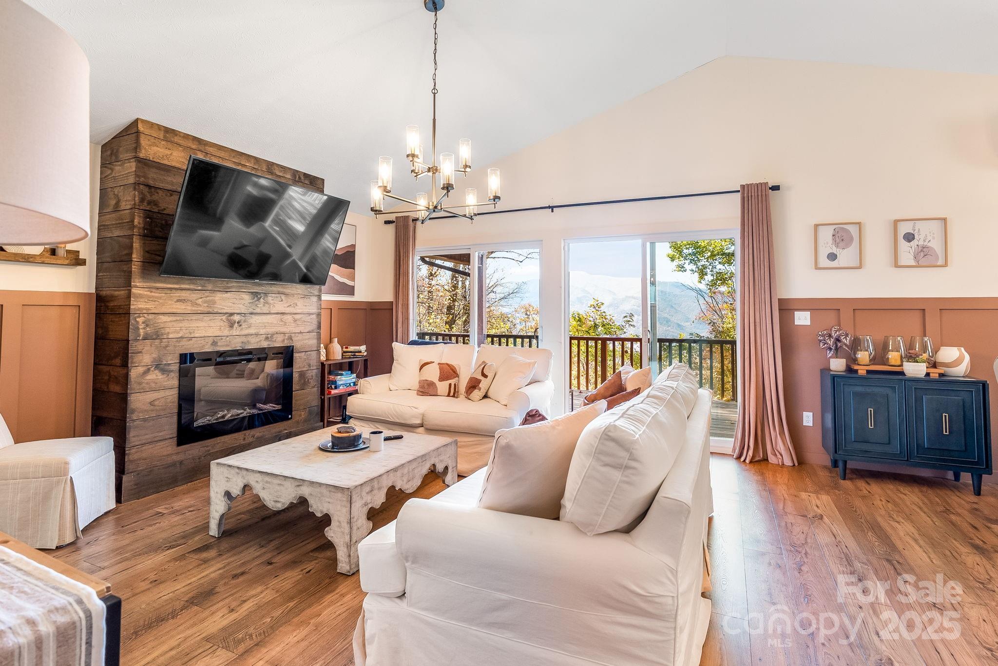 146 Promiseland Road Canton, NC 28716 - Photo 11 of 30 a living room with furniture fireplace and flat screen tv