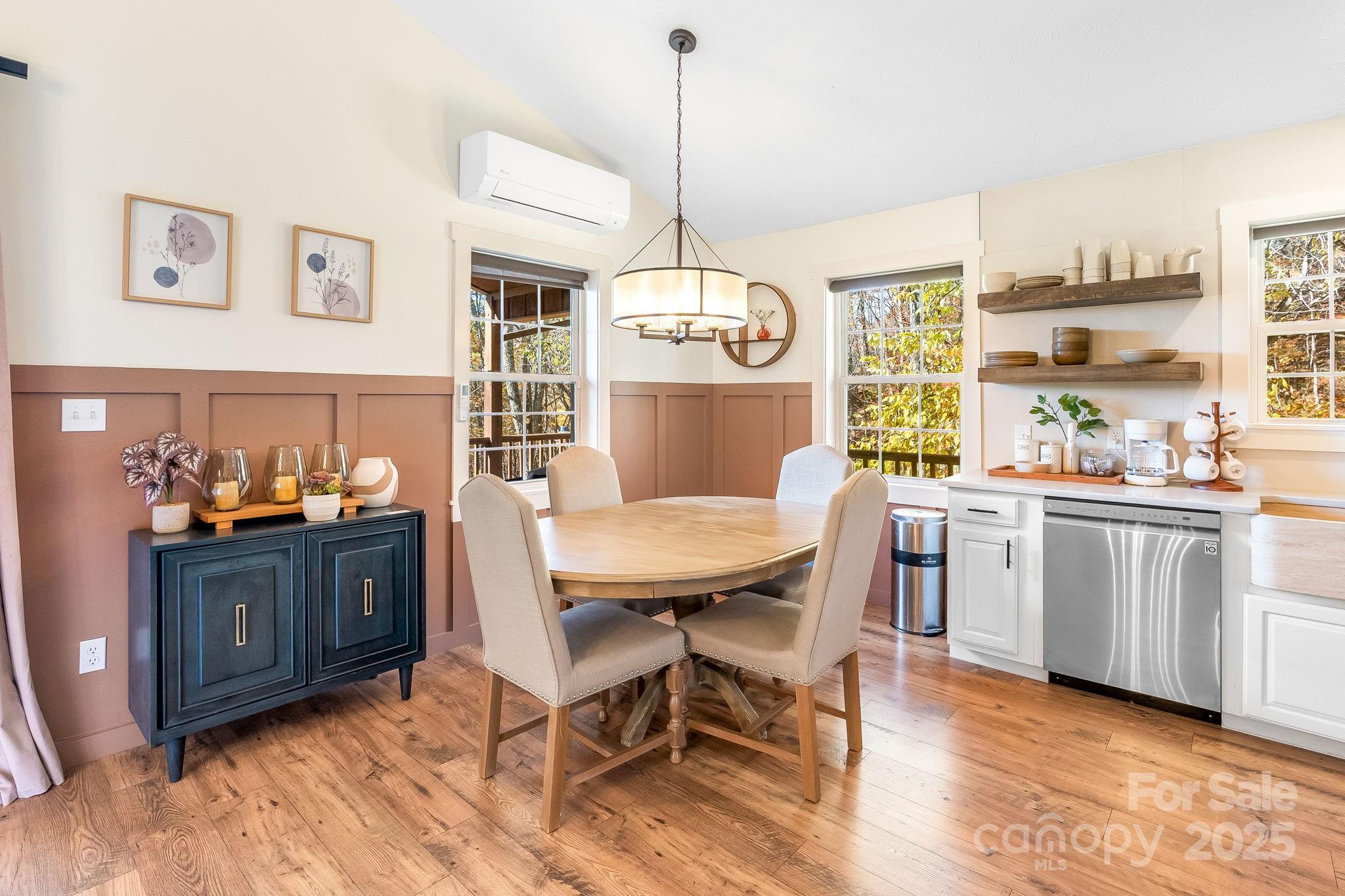 146 Promiseland Road Canton, NC 28716 - Photo 13 of 30 a view of a dining room with furniture window and wooden floor