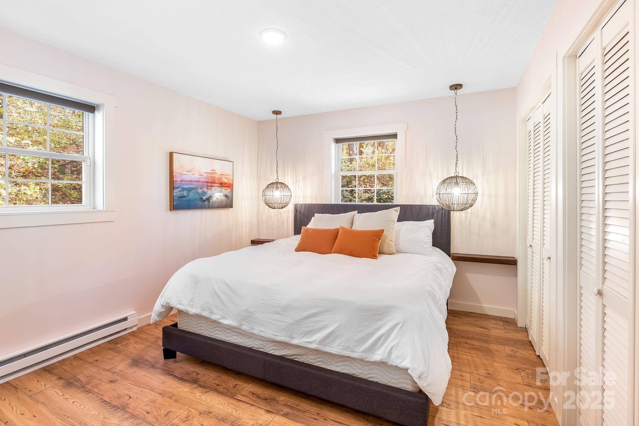 146 Promiseland Road Canton, NC 28716 - Photo 15 of 30 a bedroom with a bed and a window