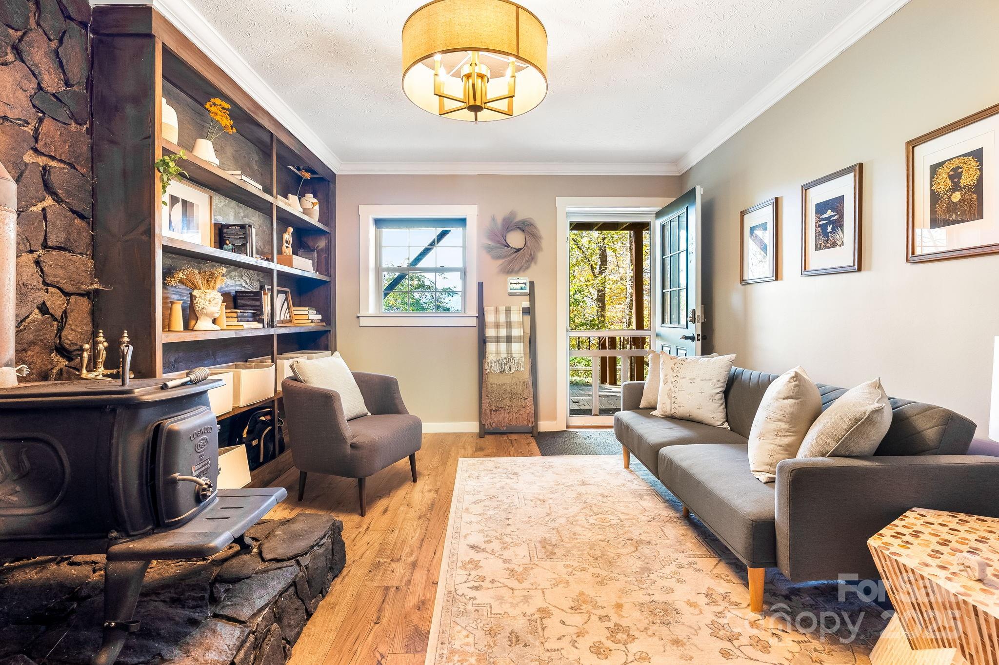 146 Promiseland Road Canton, NC 28716 - Photo 21 of 30 a living room with furniture wooden floor and a table