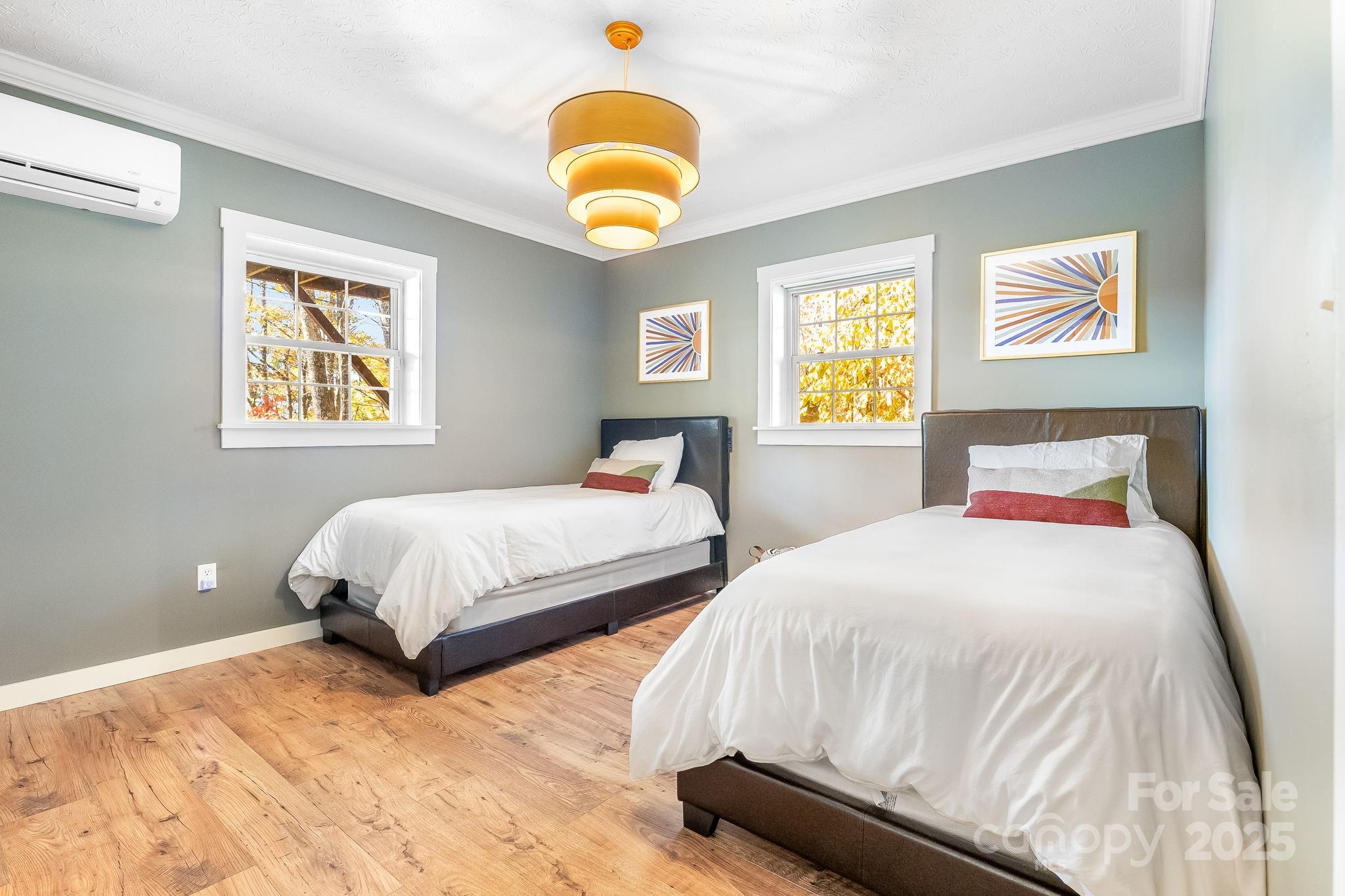 146 Promiseland Road Canton, NC 28716 - Photo 22 of 30 a bedroom with two beds and painting on the wall