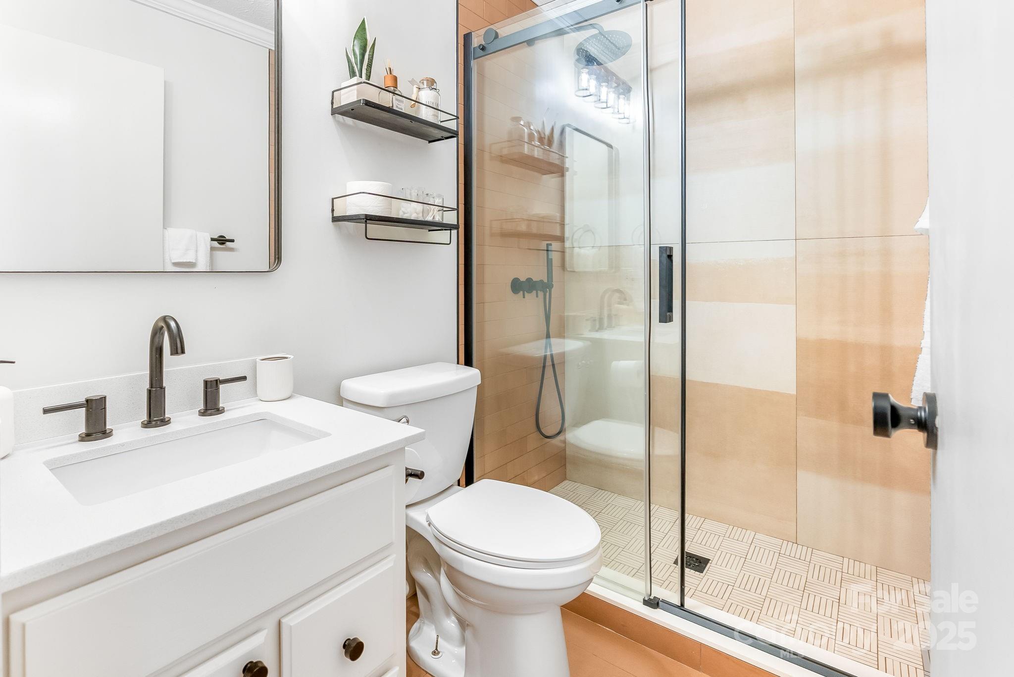 146 Promiseland Road Canton, NC 28716 - Photo 23 of 30 a bathroom with a sink toilet and shower
