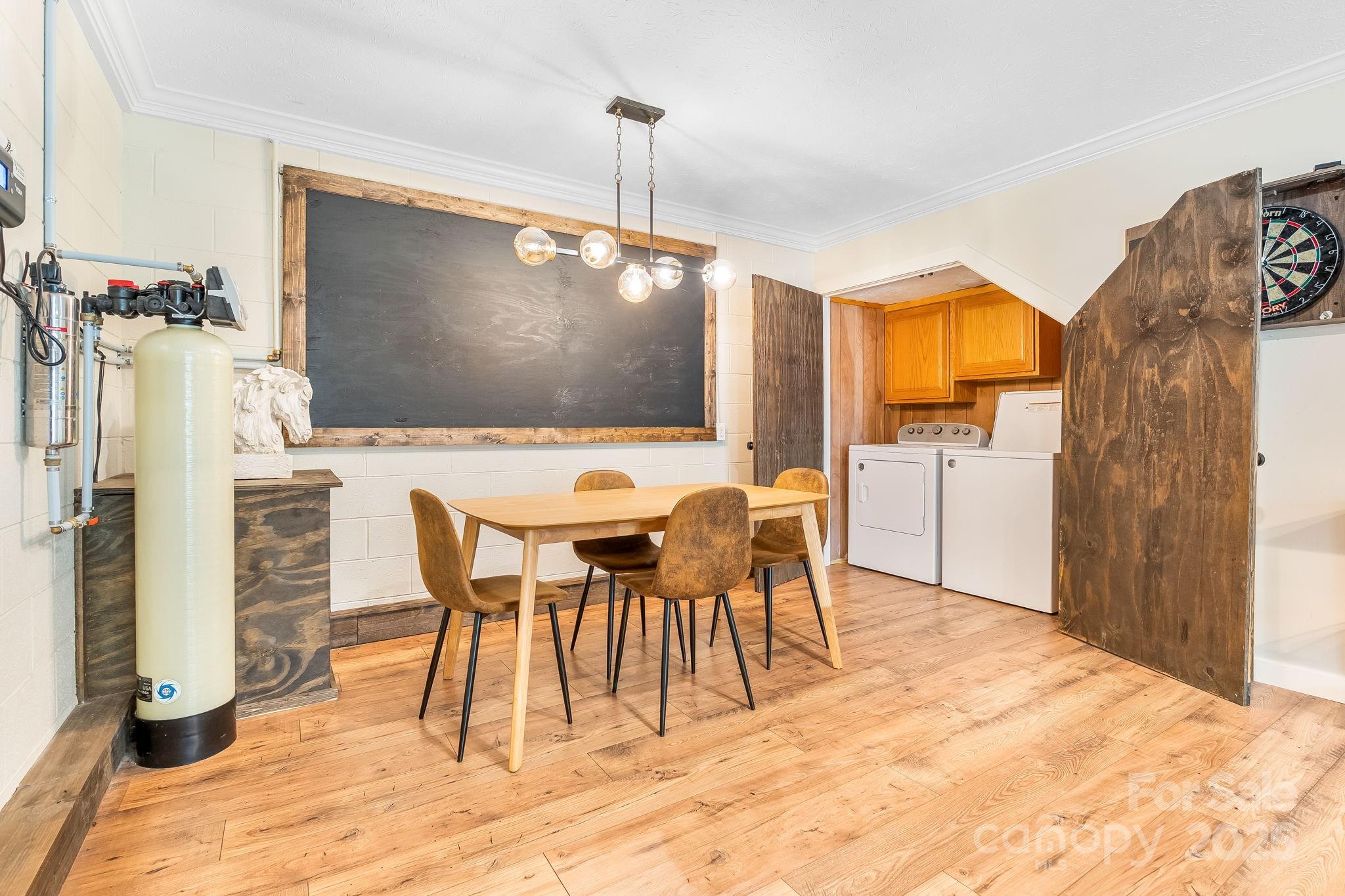 146 Promiseland Road Canton, NC 28716 - Photo 27 of 30 a view of a dining room with furniture and wooden floor