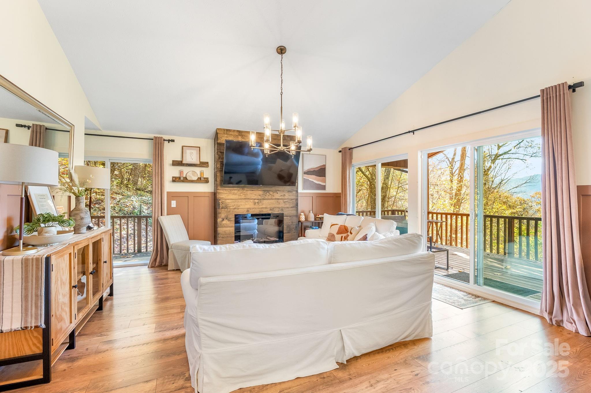 146 Promiseland Road Canton, NC 28716 - Photo 10 of 30 a living room with furniture and a floor to ceiling window