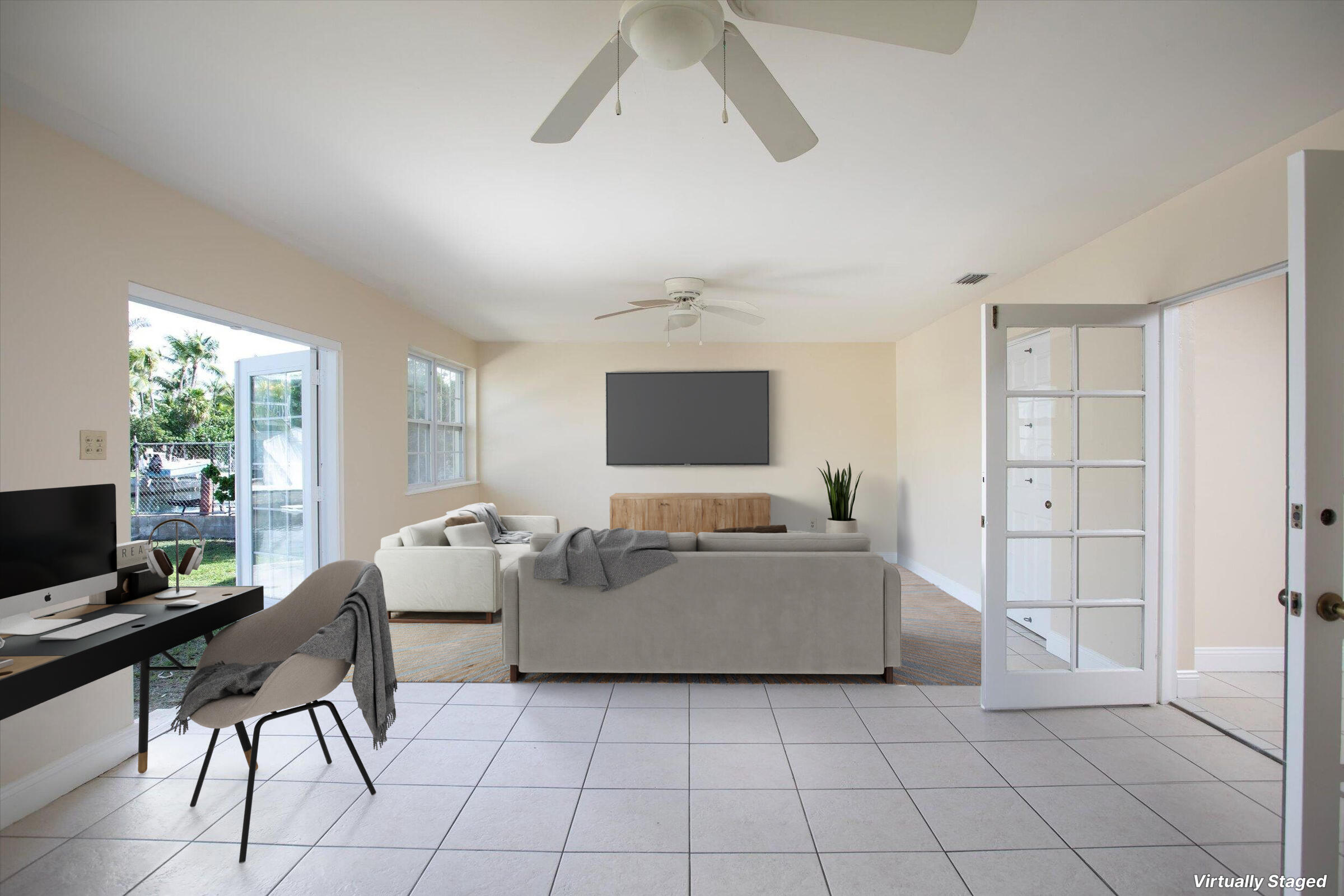 74 Key Haven Road Key West, FL 33040 - Photo 11 of 28 a living room with furniture and a flat screen tv