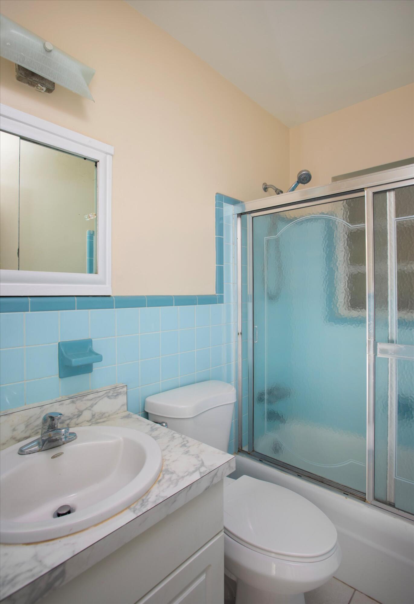 74 Key Haven Road Key West, FL 33040 - Photo 18 of 28 a bathroom with a sink toilet and shower