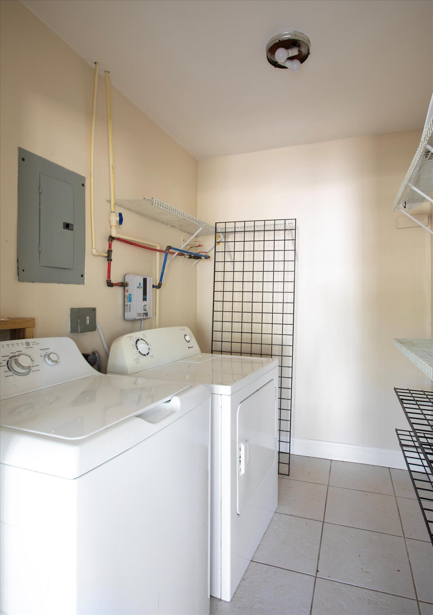 74 Key Haven Road Key West, FL 33040 - Photo 19 of 28 a utility room with dryer and washer