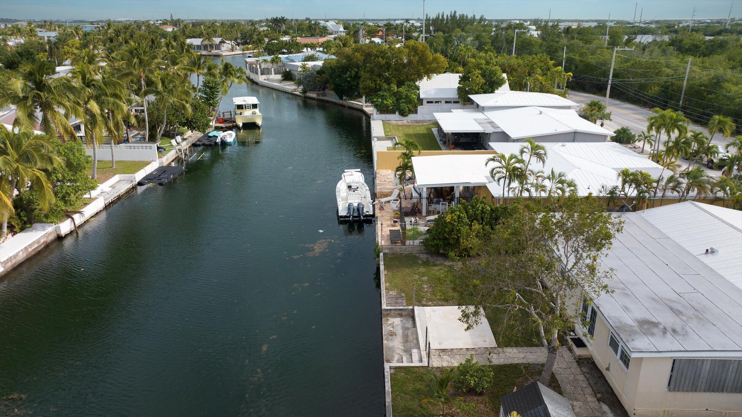 74 Key Haven Road Key West, FL 33040 - Photo 24 of 28 an aerial view of house with yard swimming pool and lake view