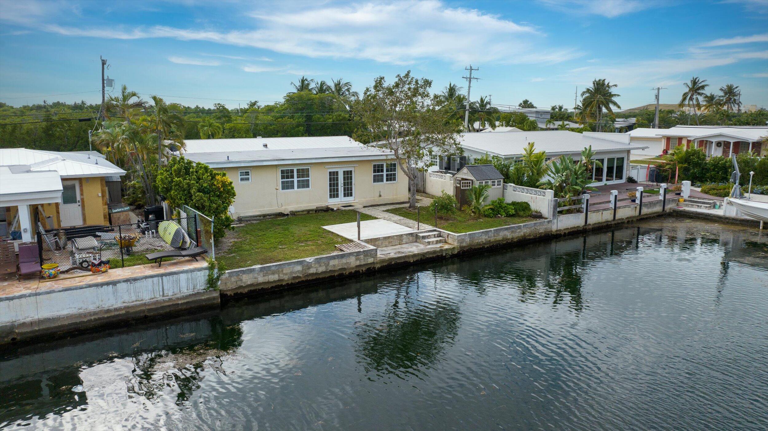 74 Key Haven Road Key West, FL 33040 - Photo 25 of 28 a view of a lake with a house
