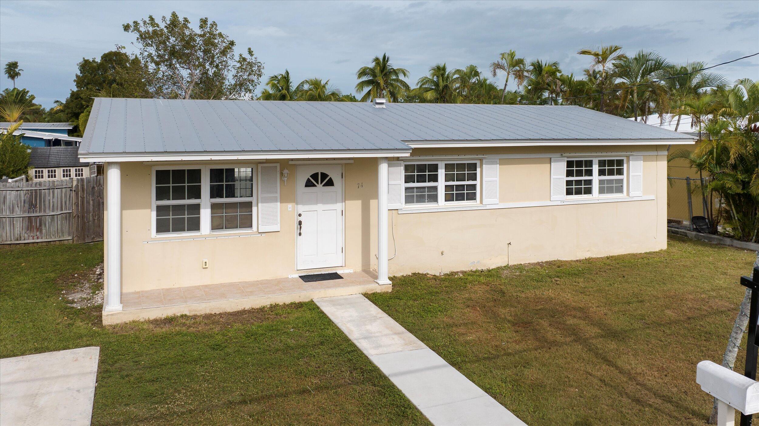 74 Key Haven Road Key West, FL 33040 - Photo 28 of 28 a front view of a house with a yard