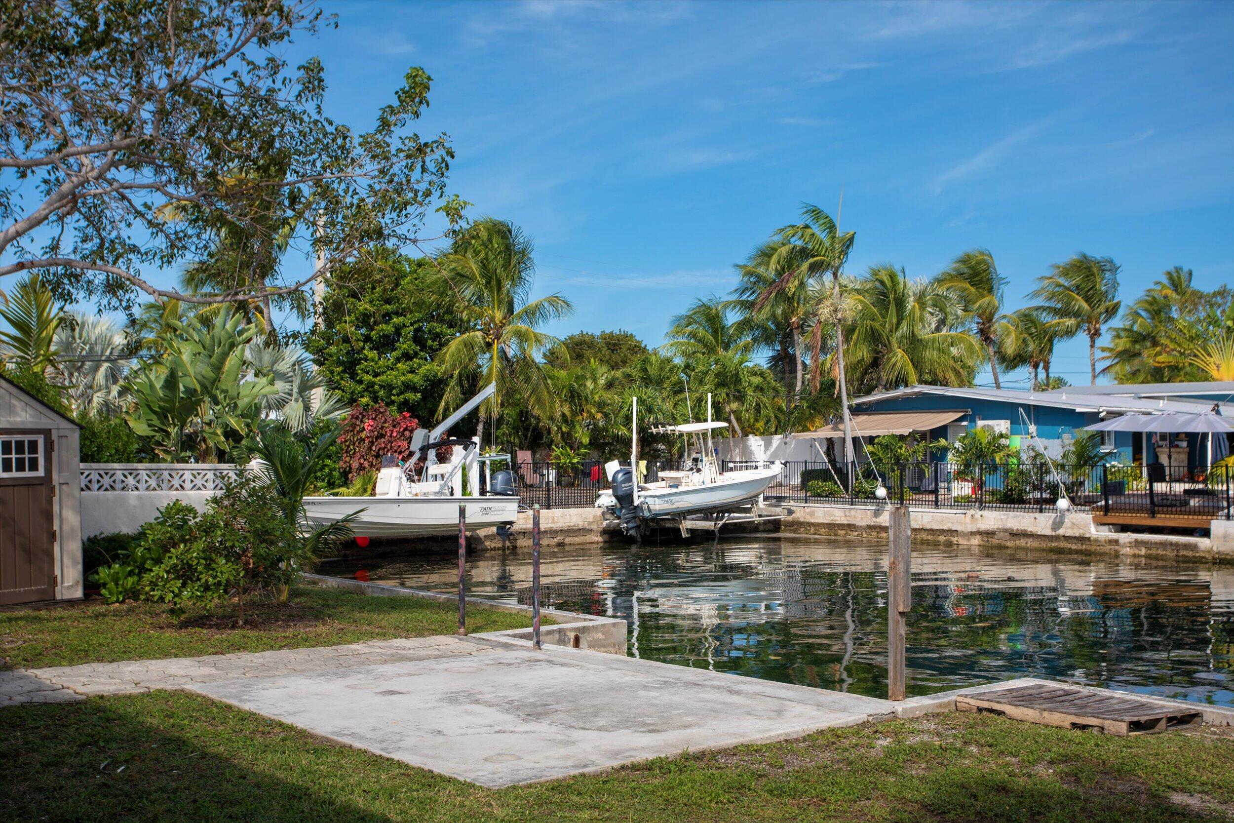 74 Key Haven Road Key West, FL 33040 - Photo 7 of 28 a view of a lake with a house and a park