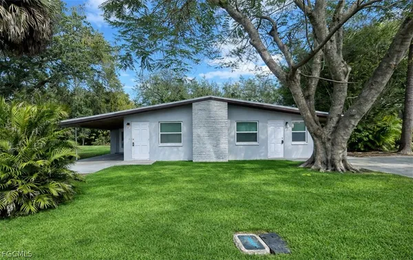a backyard of a house with seating space