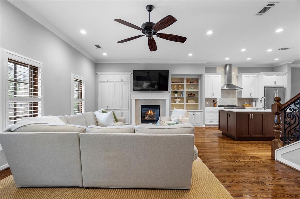 4323 Gilbert Avenue, Unit 4 Dallas, TX 75219 - Photo 11 of 40 a living room with furniture fireplace and a flat screen tv