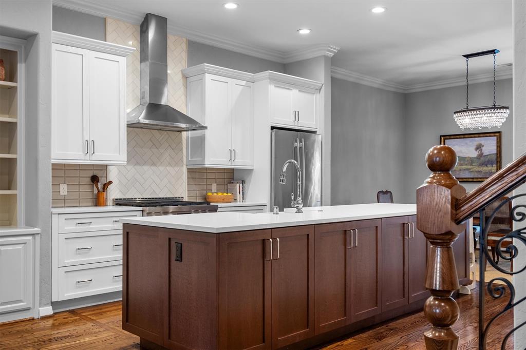 4323 Gilbert Avenue, Unit 4 Dallas, TX 75219 - Photo 14 of 40 a kitchen with a stove a refrigerator and cabinets