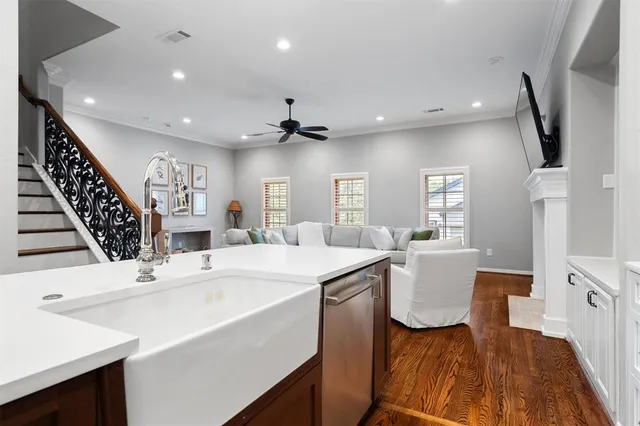 a large white kitchen with a large window