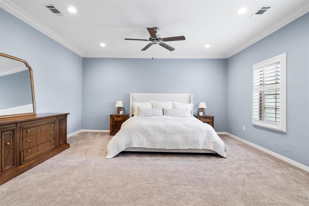 4323 Gilbert Avenue, Unit 4 Dallas, TX 75219 - Photo 28 of 40 a bedroom with a bed and window