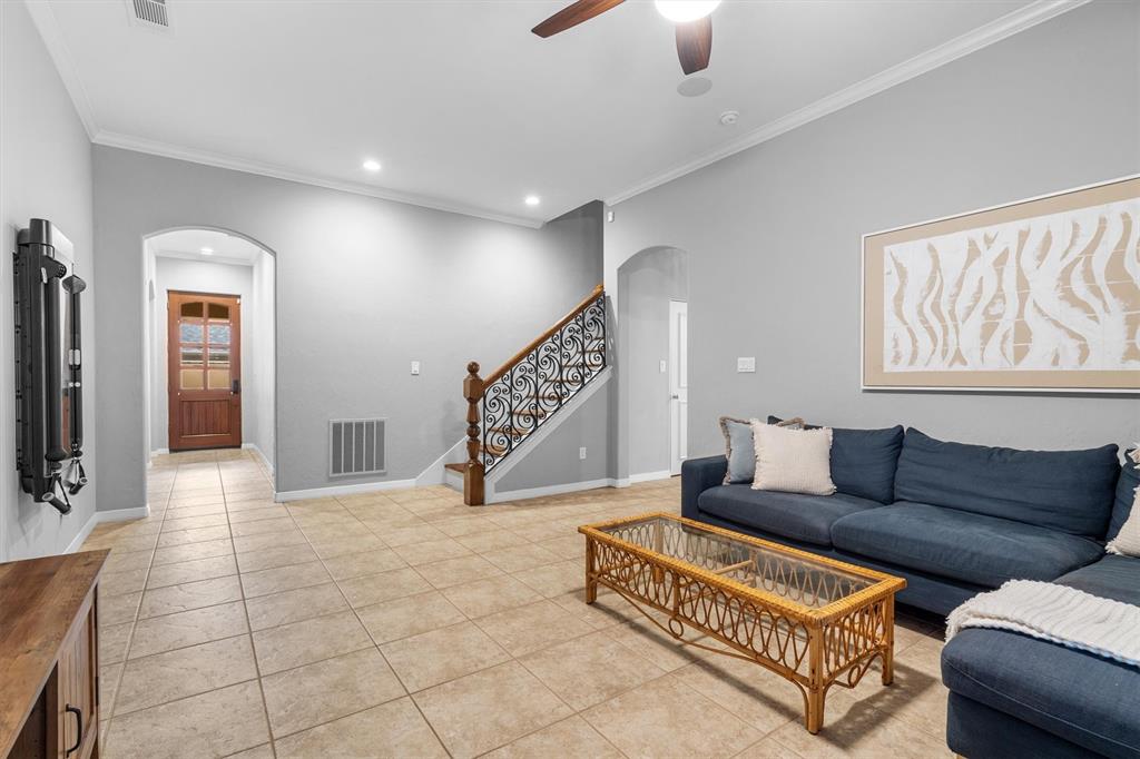 4323 Gilbert Avenue, Unit 4 Dallas, TX 75219 - Photo 6 of 40 a living room with furniture and a flat screen tv