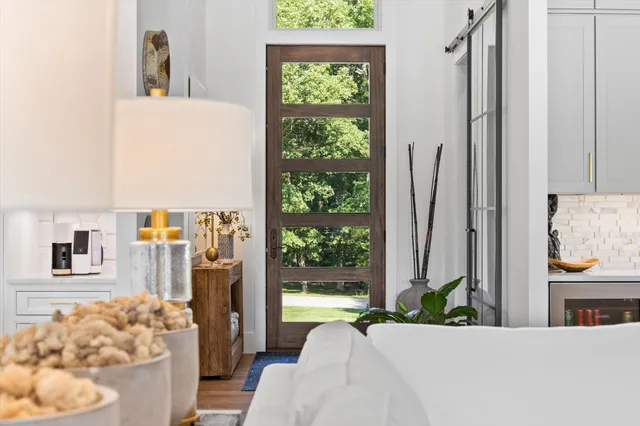 a kitchen with stainless steel appliances granite countertop a kitchen island a stove a table and chairs in it