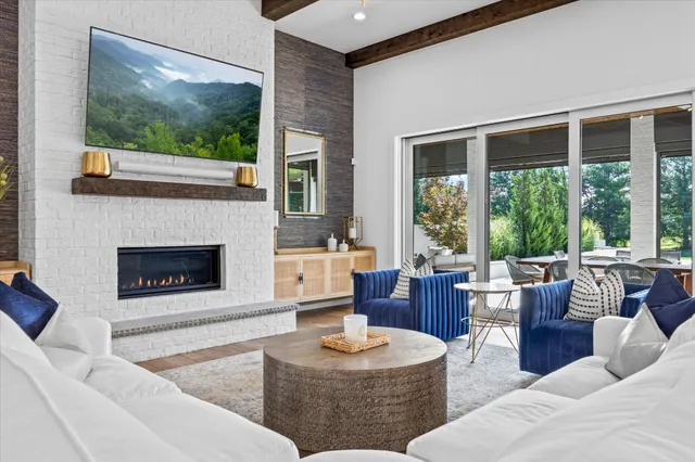 a large kitchen with stainless steel appliances lots of counter space and wooden floor