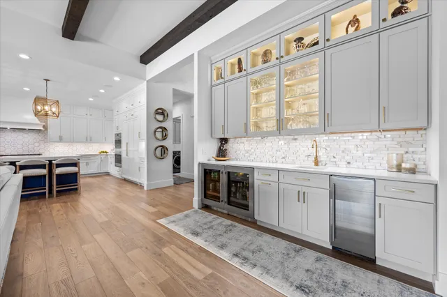 a spacious bathroom with a sink a mirror and a bathtub