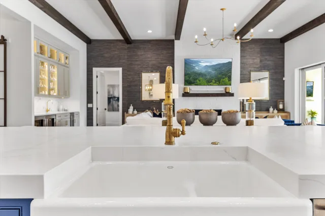 a kitchen with a refrigerator and window