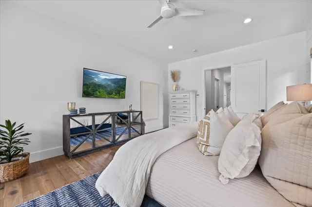 a outdoor dining space with furniture and a flat screen tv